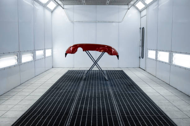 istock Automobile painting chamber or workshop interior with freshly painted bumper. 1314854139