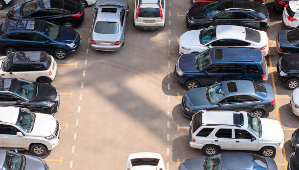 istock cars parked in a public parking 1314854763