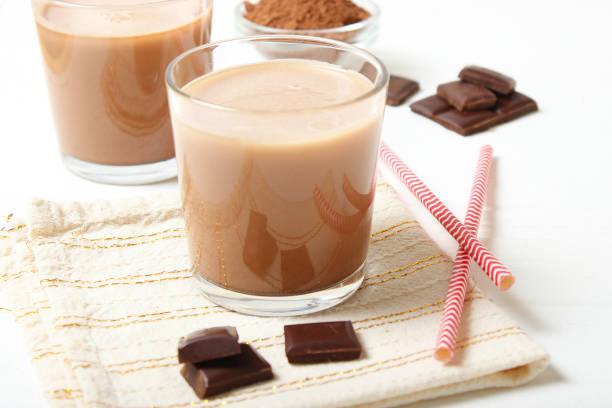 istock chocolate milk in a glass on the table. 1314855572