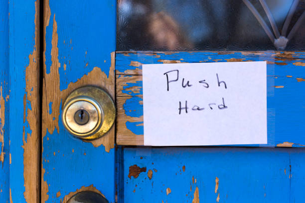 istock Sign on Weathered Blue Door: 