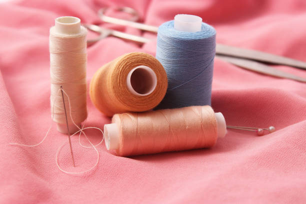 istock Set of different sewing accessories on a colored background close-up 1314865699