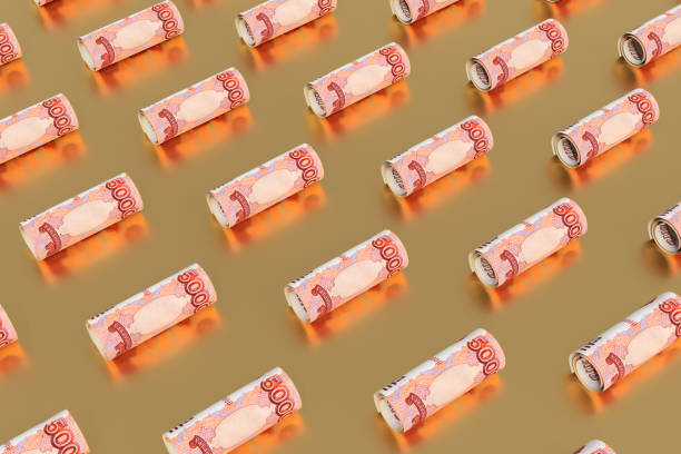 istock Rolled up ruble bills lie on a golden surface. Creative money pattern. 3d illustration. 1314870172