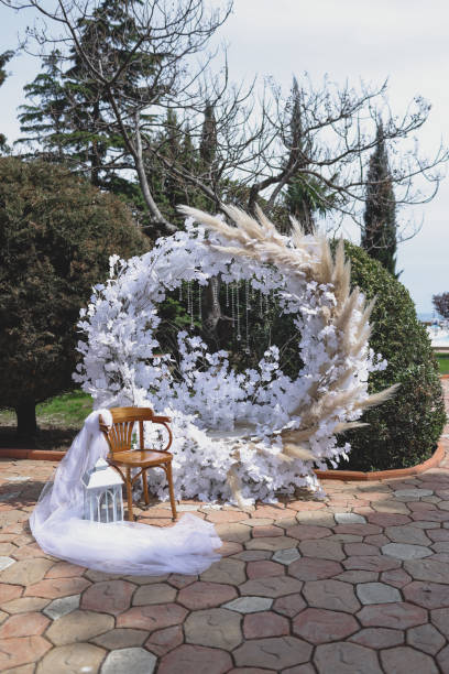 Fragment of a wedding arch for ceremony decorated with pink flowers.-Image