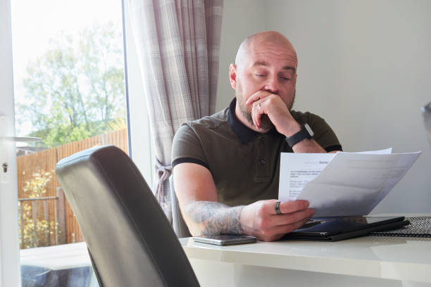 istock Worried homeowner looking at latest bills 1314870806