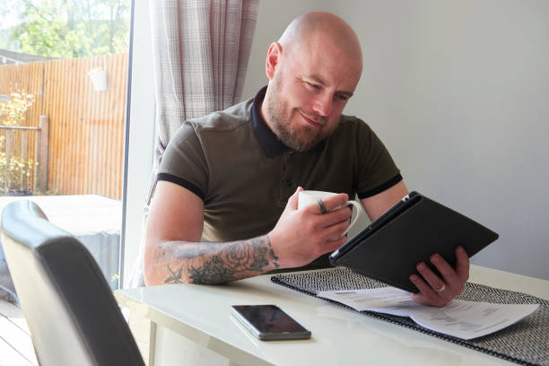 istock Happy man reading his latest credit score 1314870828