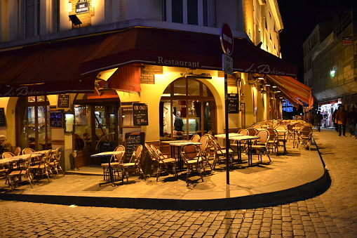 FRANCE, PARIS. 20.02.2012. Very cute, colorful and pink cafe facade in Paris Street during night.
