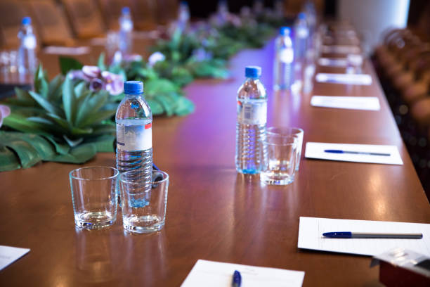 istock conference table with bottles of water and papers 1314871608