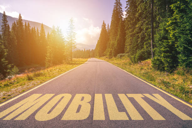 istock Mobility written on road in the mountains. Mobility text on the road. 1314875487