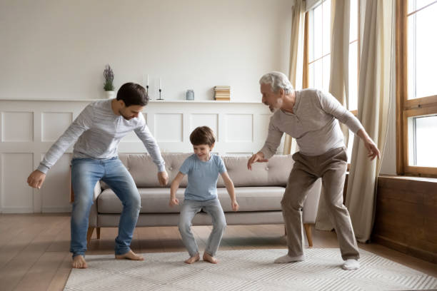 istock Smiling three generations of men dancing together 1314877536