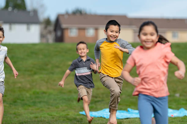 istock Happy group of kids playing chase 1314878304