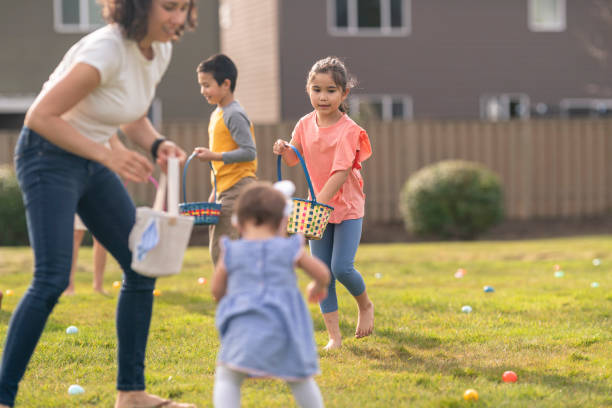 istock Multi-ethnic group of children participating in Easter egg hunt outdoors 1314878317