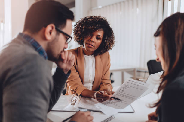 Couple preparing to sign a contract of sale