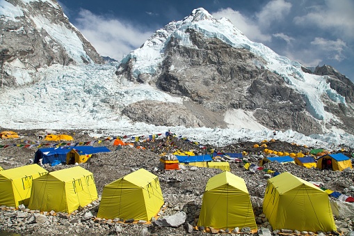 View from Mount Everest base camp, yellow tents and prayer flags, trek to Everest base camp, Nepalhimalaya mountains