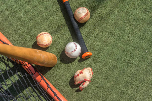 Strong baseball Crushed ball inside a batting cage practice. baseball cage stock pictures, royalty-free photos & images