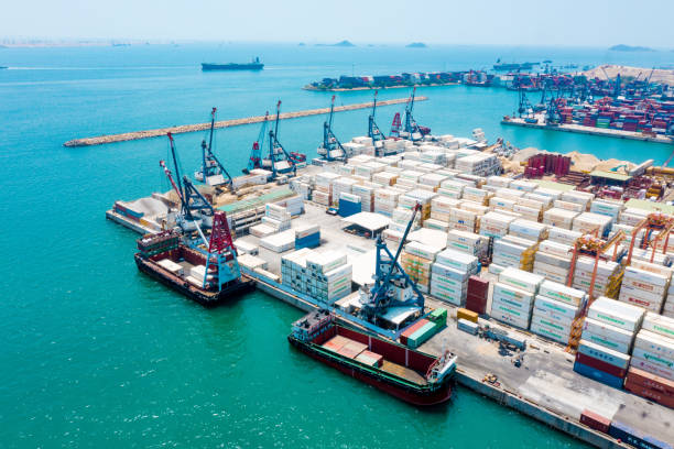 istock Cargo ship terminal, Unloading crane of cargo ship terminal, Industrial port with containers and container ship 1314889661