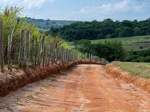 A dirt road going down. Road trip.