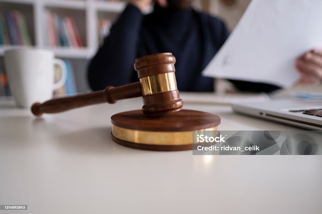 Lawyer in office with gavel, symbol of justice Law Stock Photo