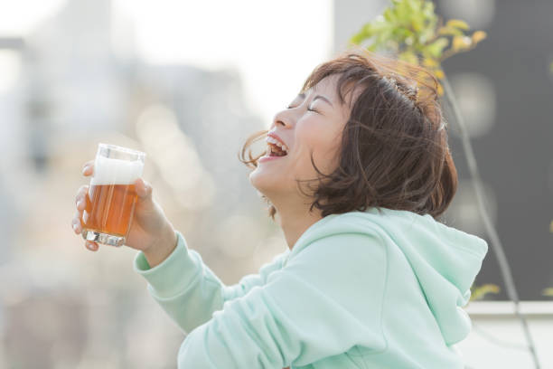 Young woman spending time at home Person woman drinking beer stock pictures, royalty-free photos & images