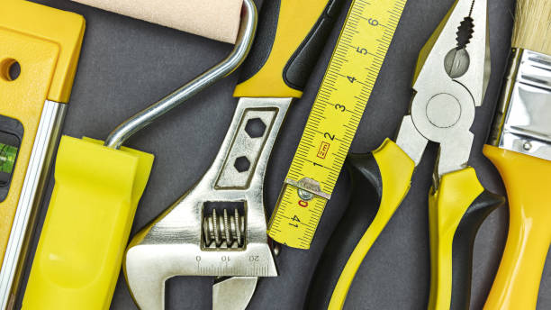 istock set of different tools for home renovation or DIY on dark grey background. closeup top view 1314894658