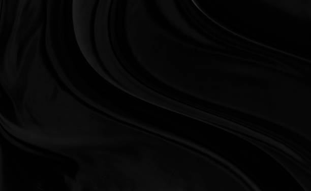 istock Black gray satin dark fabric texture luxurious shiny that is abstract silk cloth background with patterns soft waves blur beautiful. 1314898850