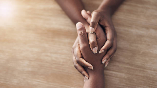 High angle shot of two unrecognisable women holding hands Kindness makes the world a better place guidance support stock pictures, royalty-free photos & images