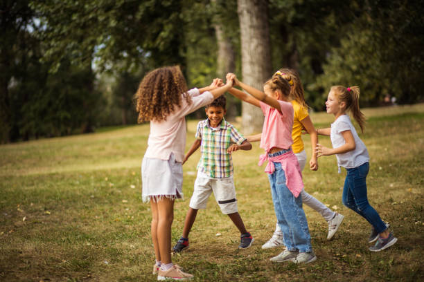 istock Happy kids playing in the park. 1314903263