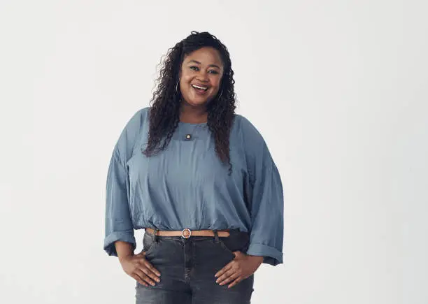 Photo of Studio portrait of a confident young woman standing against a white background