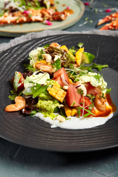 istock Delicious salads served on plates side view 1314904563