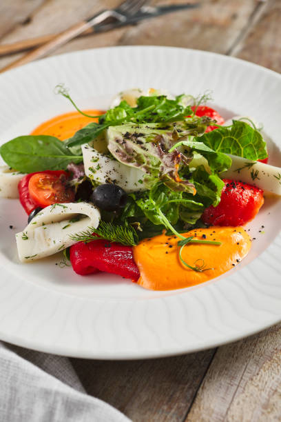istock Roasted pepper salad with calamari and fresh greens 1314904654