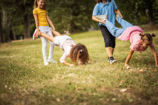 istock Group of school kids having fun in nature. 1314907459