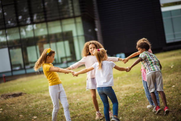 istock Large group of school kids having fun in nature. 1314907469