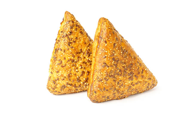 istock triangles with meat isolated on white background. sprinkle freshly baked meat with konzhut. 1314907497