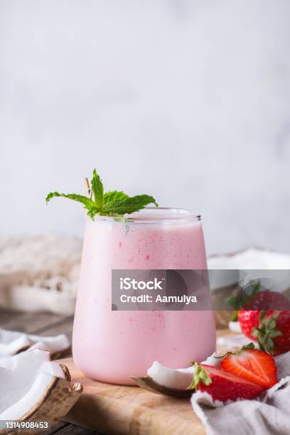 Healthy Vegan Coconut And Strawberry Indian Lassi Stock Photo - Download Image Now - Strawberry, Smoothie, Coconut