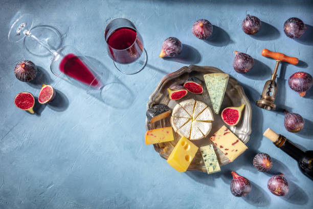 istock Wine and cheese tasting background with a place for text. Red wine, Brie etc 1314910755