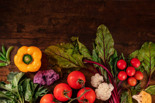 istock Fresh vegetable background, top shot on a dark rustic wooden table 1314911293