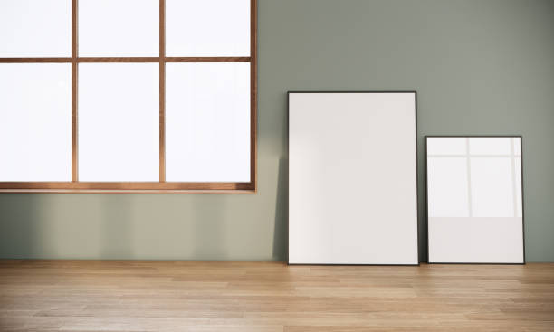 istock blank picture frames in Japandi style room interior design decorating with wood. large window in the room. 3d rendering background 1314912440