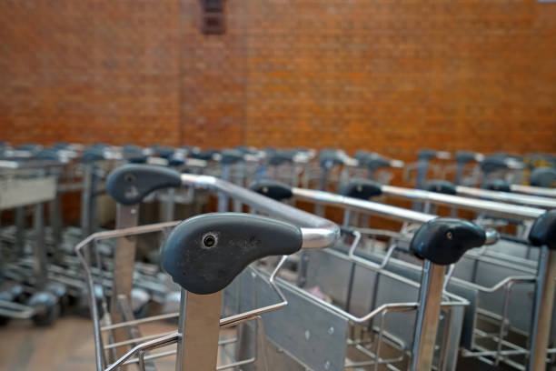 istock Rows of airport luggage carts 1314912658