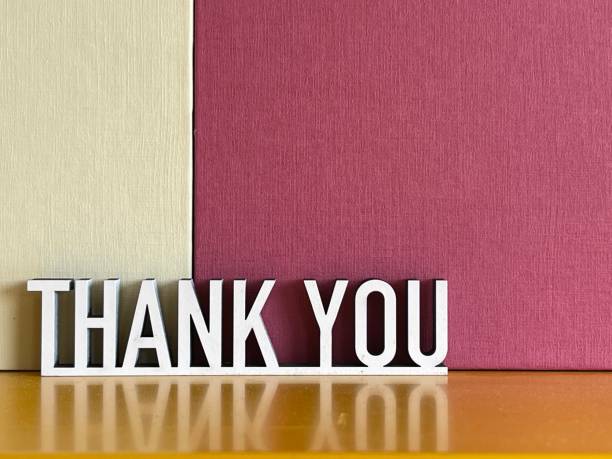 istock Thank you on beige red background 1314916059