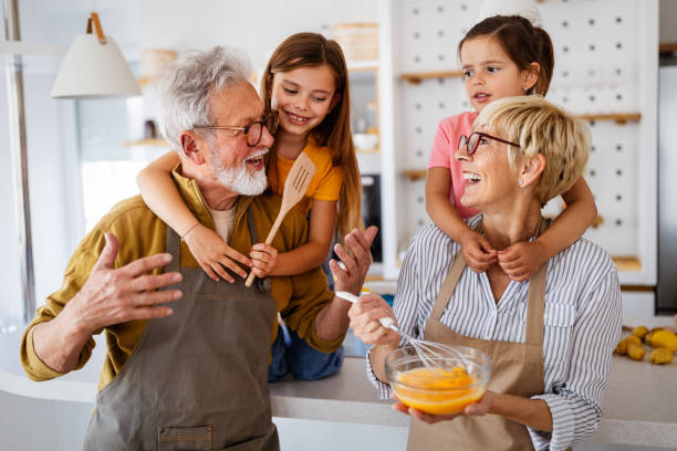istock Cheerful family spending good time together while cooking in kitchen 1314917894
