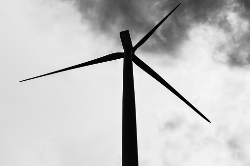 Black and white photo with Turbine and clouds