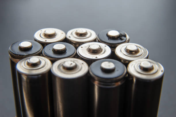 istock Batteries arranged next to each other on a dark surface. 1314921085