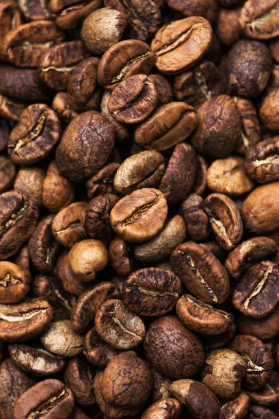 Brown roasted coffee beans. Closeup shot of coffee beans.