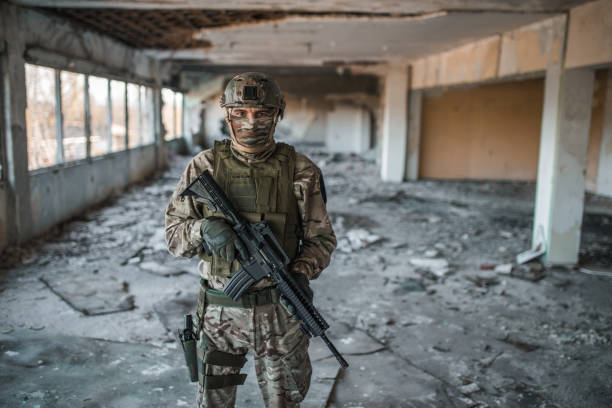 istock Special forces soldier armed with rifle in camouflage uniform in war zone 1314925045