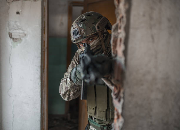 istock Professional soldier in camouflage uniform fighting in conflict zone 1314925314
