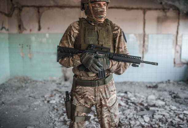 istock Special forces soldier in camouflage uniform on watch in conflict zone 1314925376