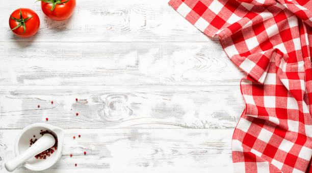 istock White wooden table covered with red tablecloth. 1314925390