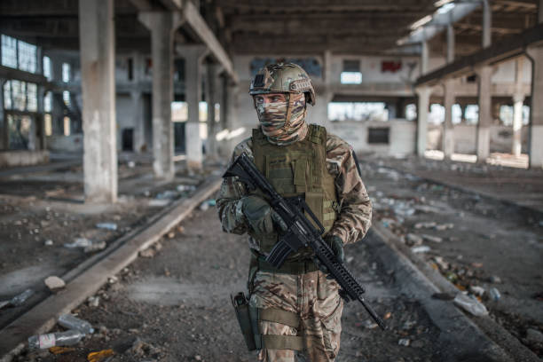 istock Professional armed soldier in camouflage uniform on patrol in war zone 1314926480