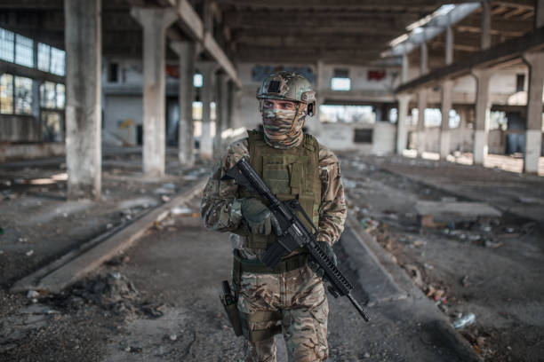 istock Professional soldier in camouflage uniform on patrol in war zone 1314926574