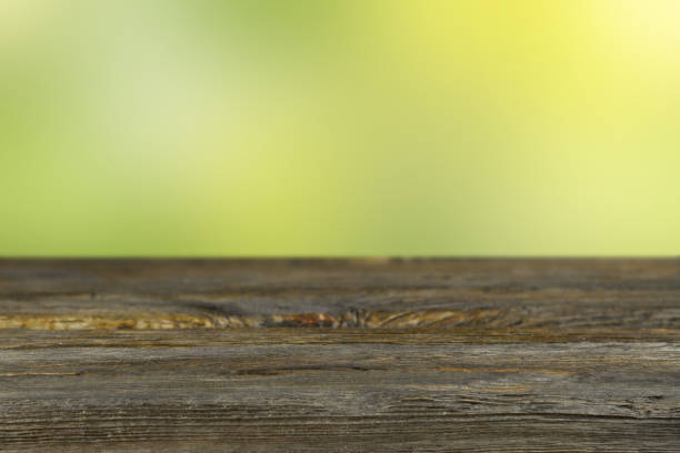 istock Green abstract background with wooden board. 1314927211