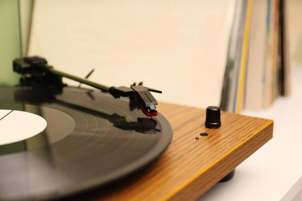 istock Turntable with vinyl record on white table, closeup. Space for text 1314928147